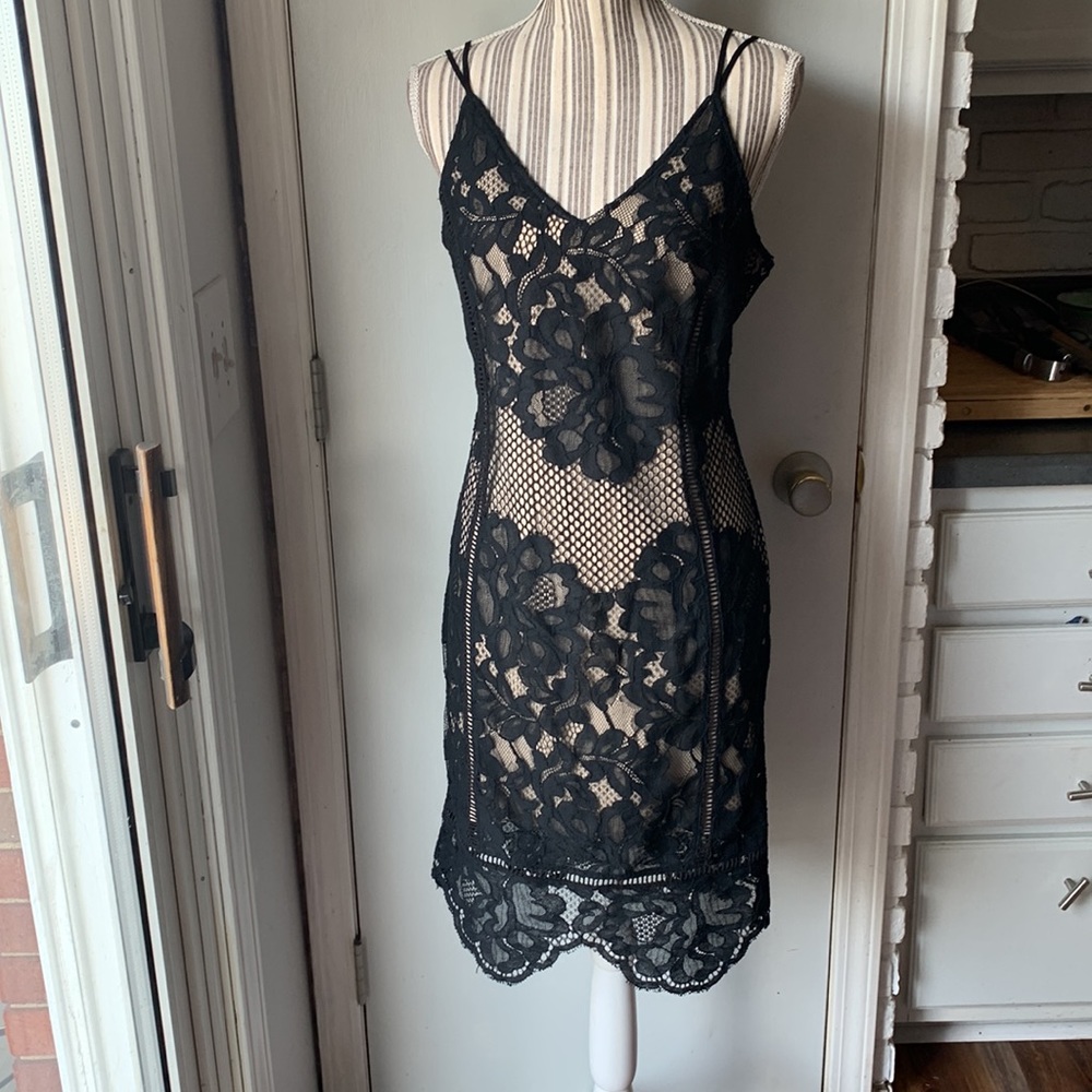 Ark nc. Boutique black lace nude dress with adjustable spaghetti straps.